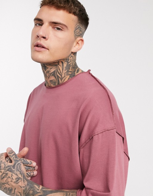 ASOS DESIGN oversized heavyweight t-shirt with half sleeve and seam detail in pink