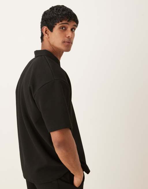 ASOS DESIGN - Oversized polo van zware stof met textuur in zwart, deel van co-ord set