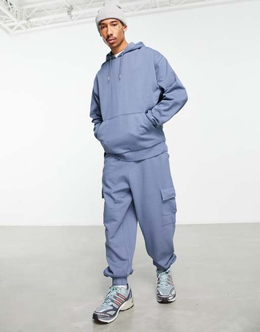 ASOS DESIGN - Oversized hoodie en oversized joggingbroek met cargozak in blauw
