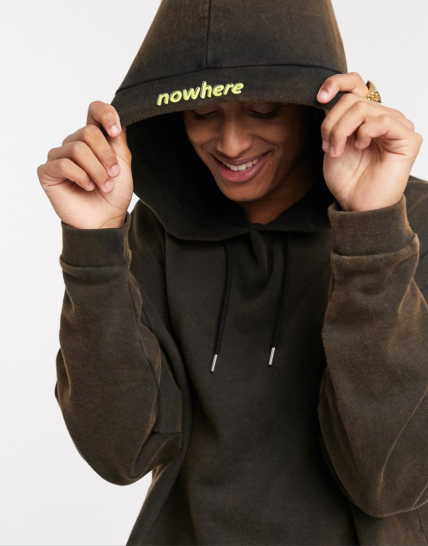 ASOS DESIGN oversized hoodie in black with wash and text hood print