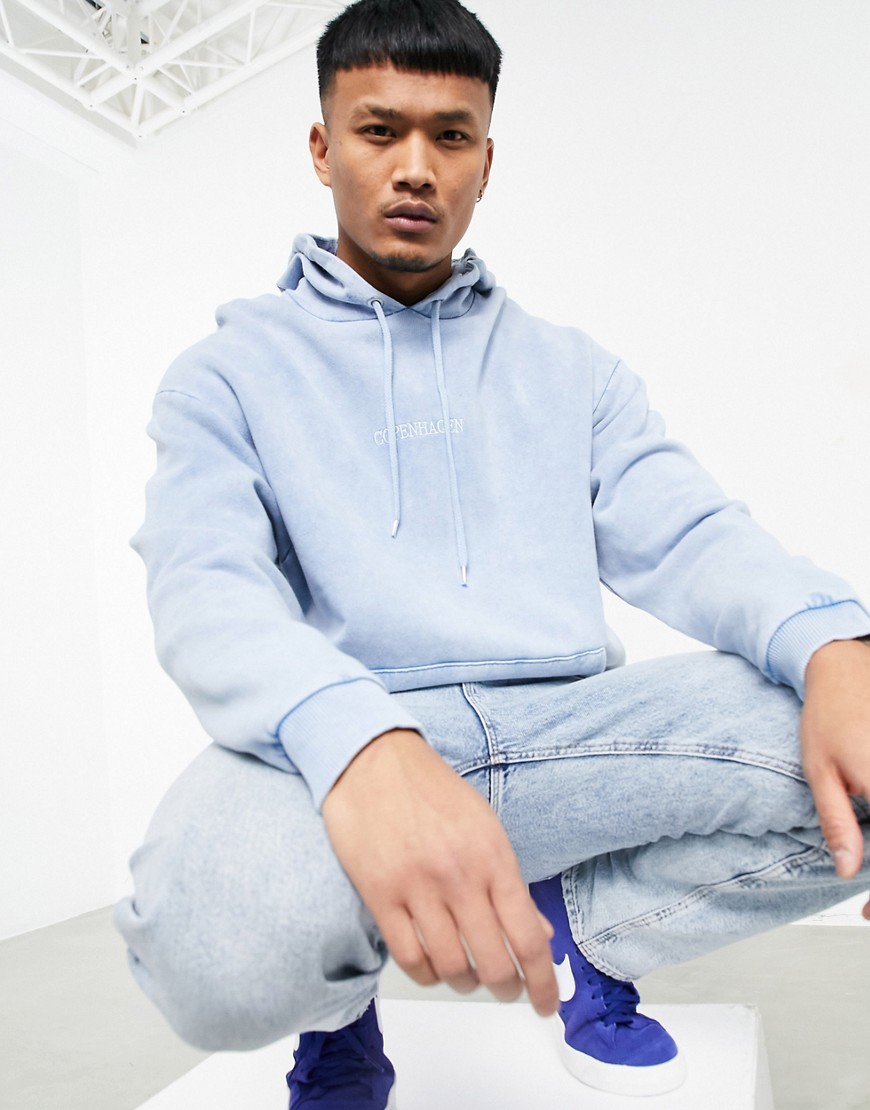 ASOS DESIGN oversized hoodie in blue acid wash with 'Copenhagen' front print-Blues