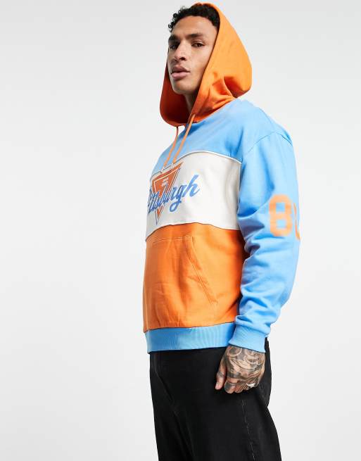 ASOS DESIGN oversized hoodie in blue orange colour block with multiplacement print