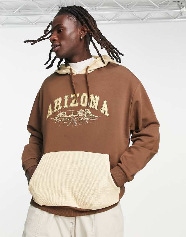 ASOS DESIGN oversized hoodie in brown color block with city print