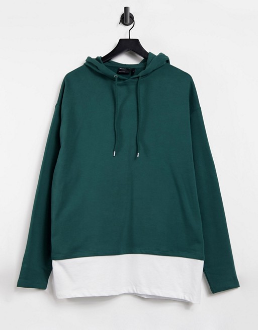 ASOS DESIGN oversized hoodie in green with white t-shirt hem