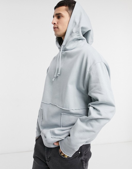 ASOS DESIGN oversized hoodie in grey with raw edge pockets