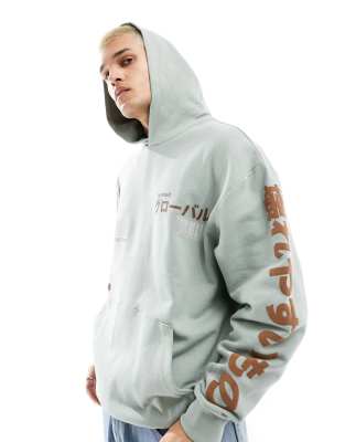 ASOS DESIGN oversized hoodie in khaki with multiplacement street print