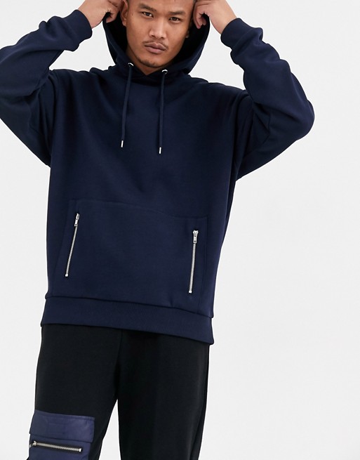ASOS DESIGN oversized hoodie in navy with silver zip pockets