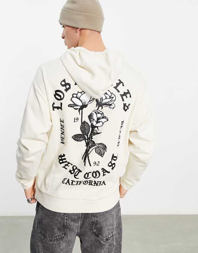 ASOS DESIGN oversized hoodie in off white with Los Angeles back and chest print