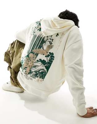 ASOS DESIGN oversized hoodie in off white with souvenir back print