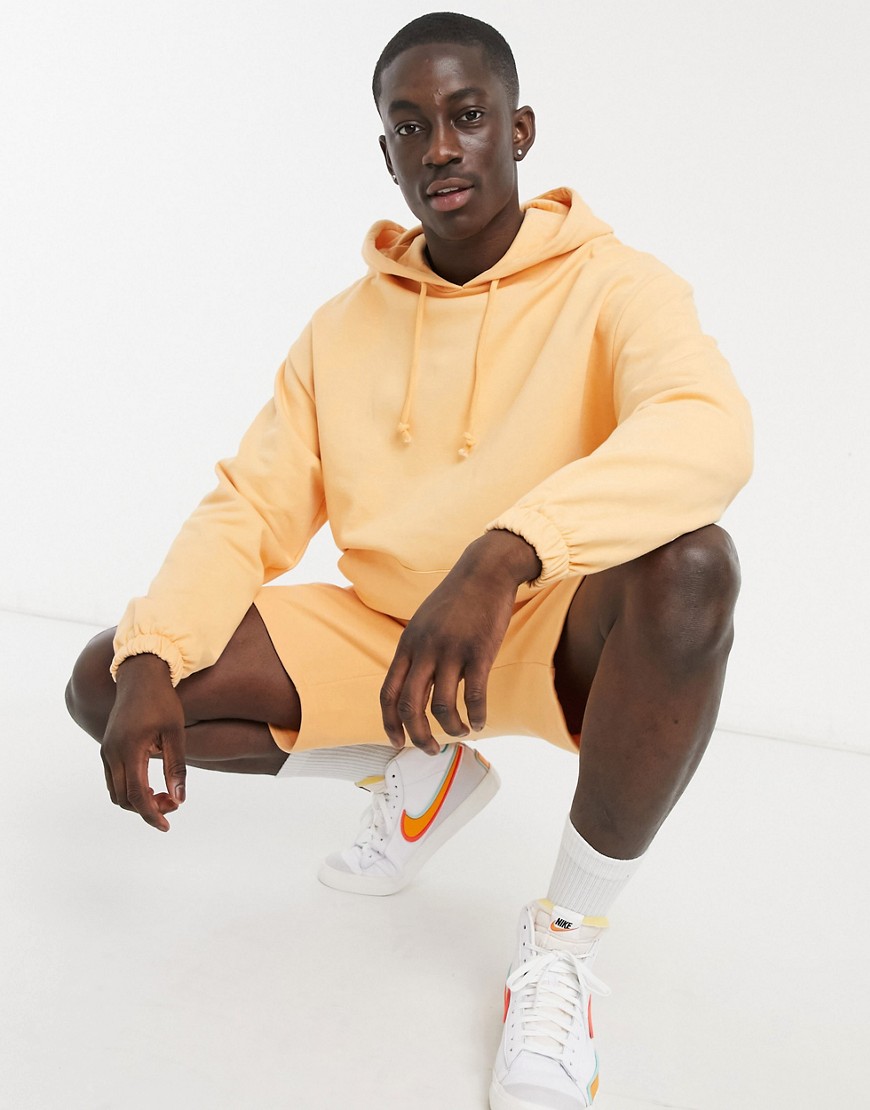 ASOS DESIGN oversized hoodie in washed orange