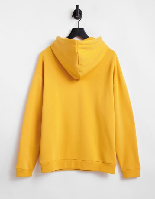 ASOS DESIGN oversized hoodie in yellow gold