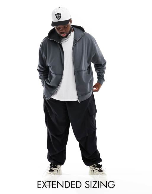 ASOS DESIGN - Oversized hoodie met ritssluiting, ritsdetail en geknabbelde randen in zwart met wassing