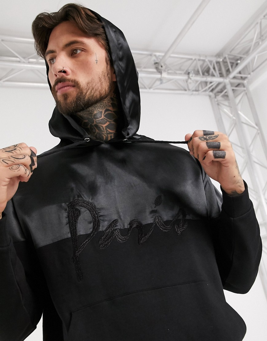 ASOS DESIGN - Oversized hoodie met satijnen panelen en Parijs-borduursel-Zwart