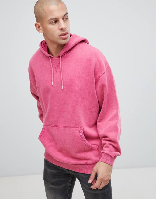 ASOS DESIGN oversized hoodie with acid wash in pink