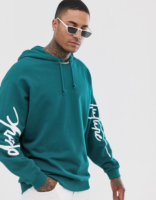 ASOS DESIGN oversized hoodie with arm print in deep teal with dark ...