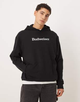 ASOS DESIGN oversized hoodie with Budweiser print in black