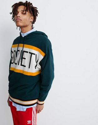 ASOS DESIGN oversized hoodie with colour block text print in green | ASOS