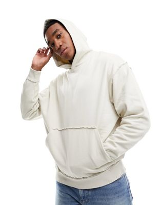 ASOS DESIGN oversized hoodie with distressing in beige