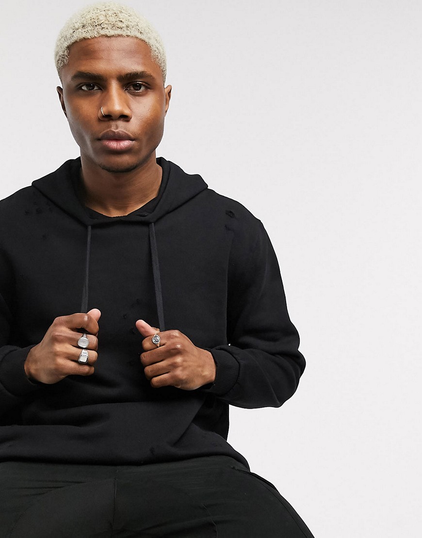 ASOS DESIGN oversized hoodie with distressing in washed black