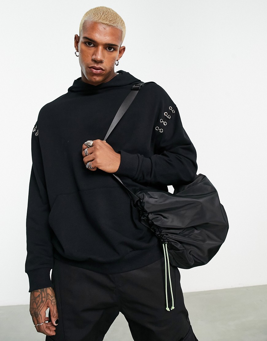 ASOS DESIGN oversized hoodie with piercing detail in black