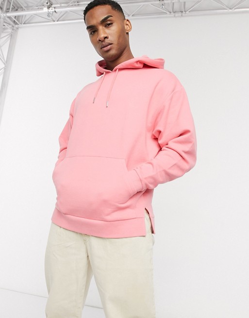 ASOS DESIGN oversized hoodie with split hem in pink