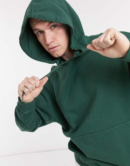 ASOS DESIGN oversized hoodie with T shirt hem in green