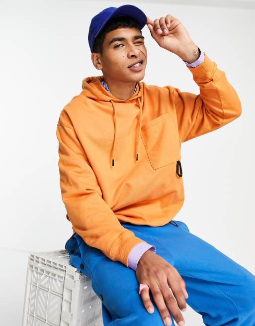 ASOS DESIGN oversized hoodie with toggle details in orange | ASOS