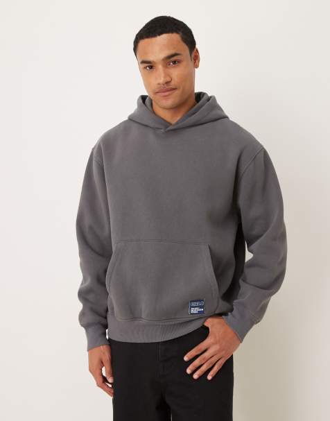 ASOS DESIGN oversized hoodie with woven label badge in acid washed charcoal - view 1