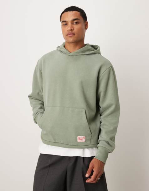 ASOS DESIGN oversized hoodie with woven label detail in washed green - view 1