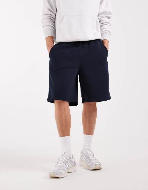 ASOS DESIGN - Oversized jersey bermudashort met lange pasvorm en biezen in marineblauw, 3 van 5