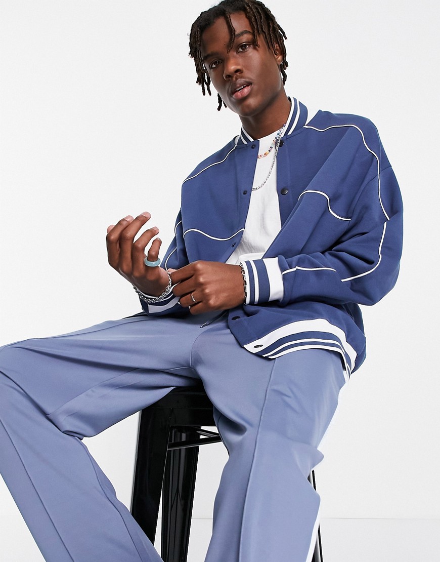 ASOS DESIGN oversized jersey bomber jacket in navy with piping-Blues