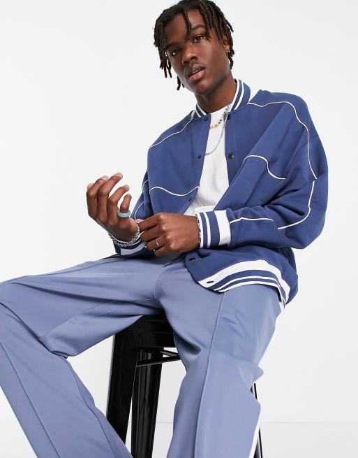 ASOS DESIGN oversized jersey bomber jacket in navy with piping