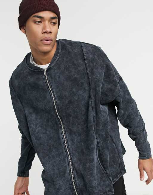 ASOS DESIGN - Oversized jersey bomberjack met inzetstukken en ongelijke zoom in zwart met acid wash
