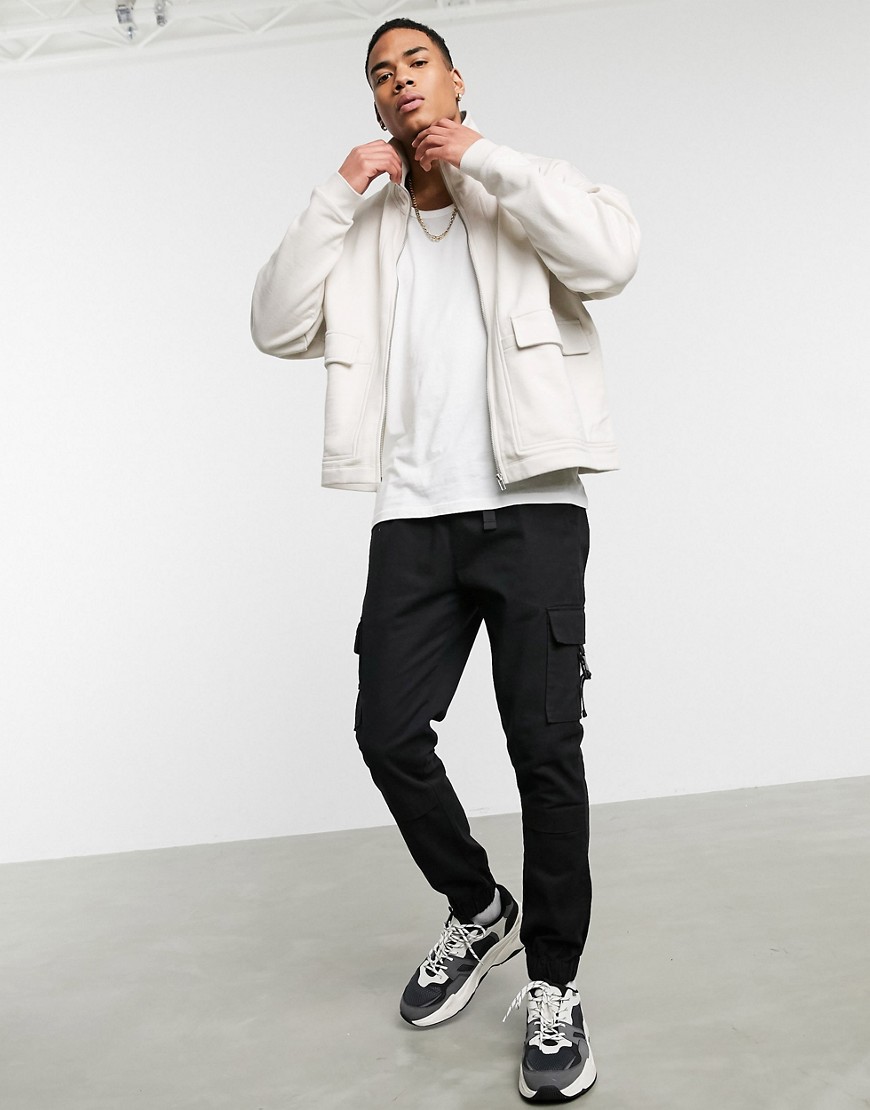 ASOS DESIGN - Oversized jersey jack met opstaande boord in gebroken wit-Grijs