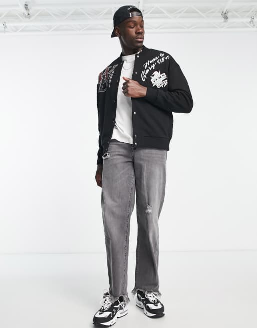 ASOS DESIGN oversized jersey jacket in black with varsity and souvenir prints, 3 of 4