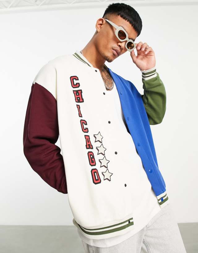 ASOS DESIGN oversized jersey jacket in navy and green blocking with print