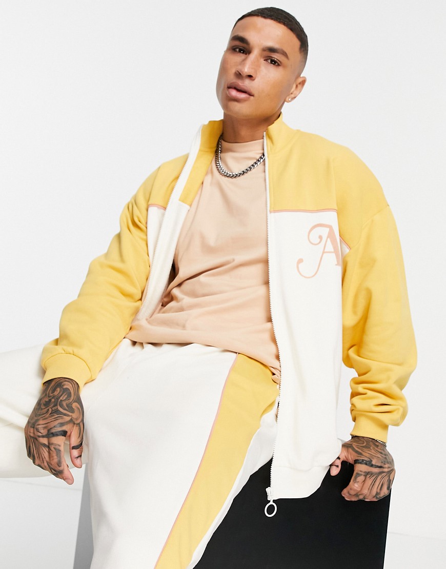 ASOS DESIGN oversized jersey jacket in neutral color block with piping details & embroidery-White