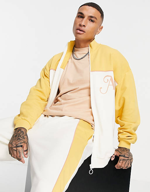 ASOS DESIGN oversized jersey jacket in neutral colour block with piping details & embroidery
