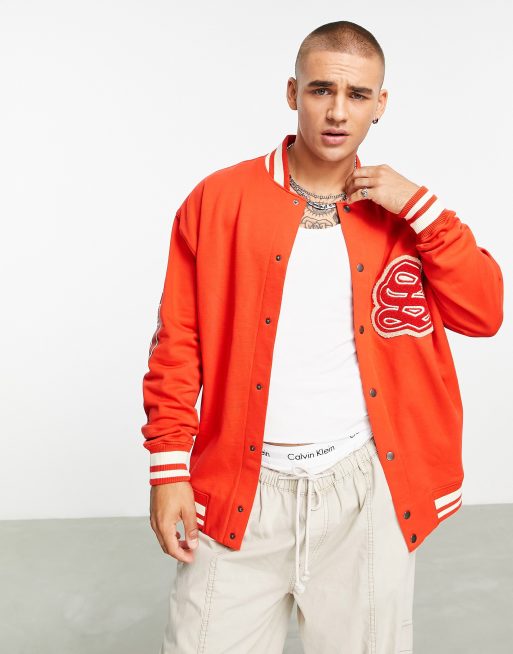 ASOS DESIGN oversized varsity cotton bomber jacket in green with embroidery  badging