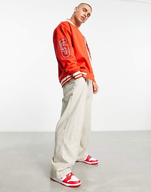 ASOS DESIGN oversized varsity jacket in red with badges