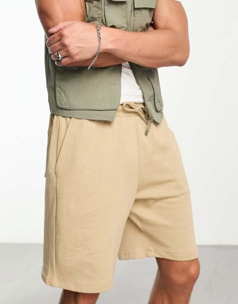 ASOS DESIGN oversized jersey mid length shorts in beige - view 1