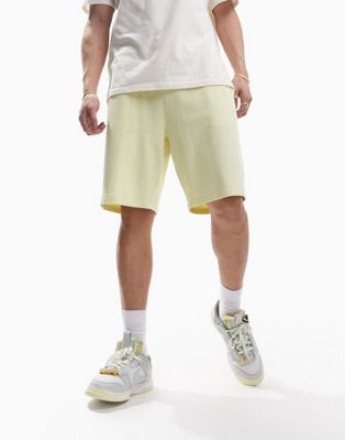 ASOS DESIGN oversized jersey mid length shorts in pastel yellow