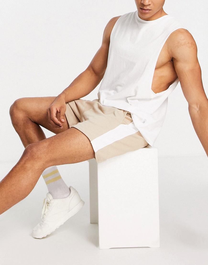 ASOS DESIGN oversized jersey shorts in beige with side stripe-Neutral