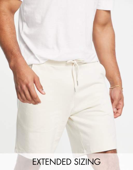 ASOS DESIGN oversized jersey shorts in beige