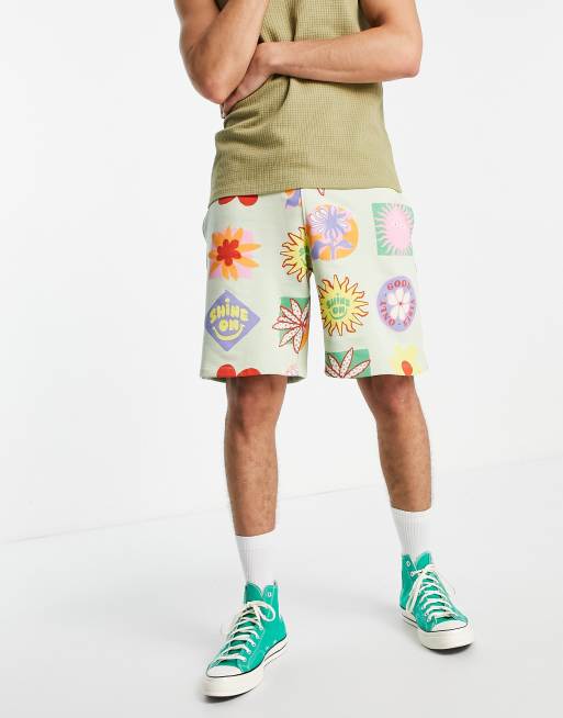 ASOS DESIGN oversized jersey shorts in green with all over prints - MULTI