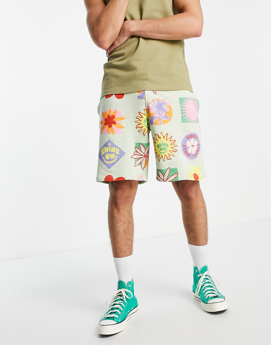 ASOS DESIGN oversized jersey shorts in green with all over prints - part of a set-Multi