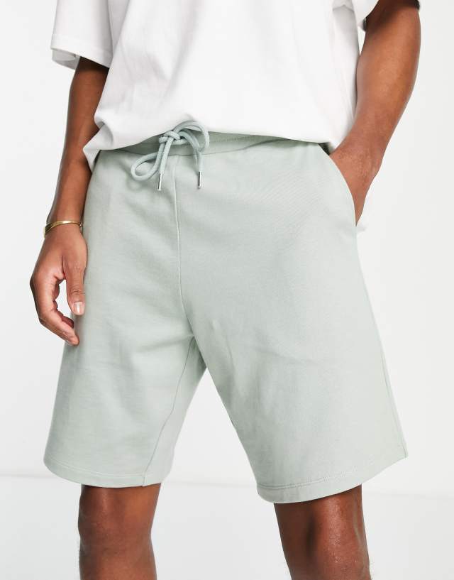 ASOS DESIGN oversized jersey shorts in green