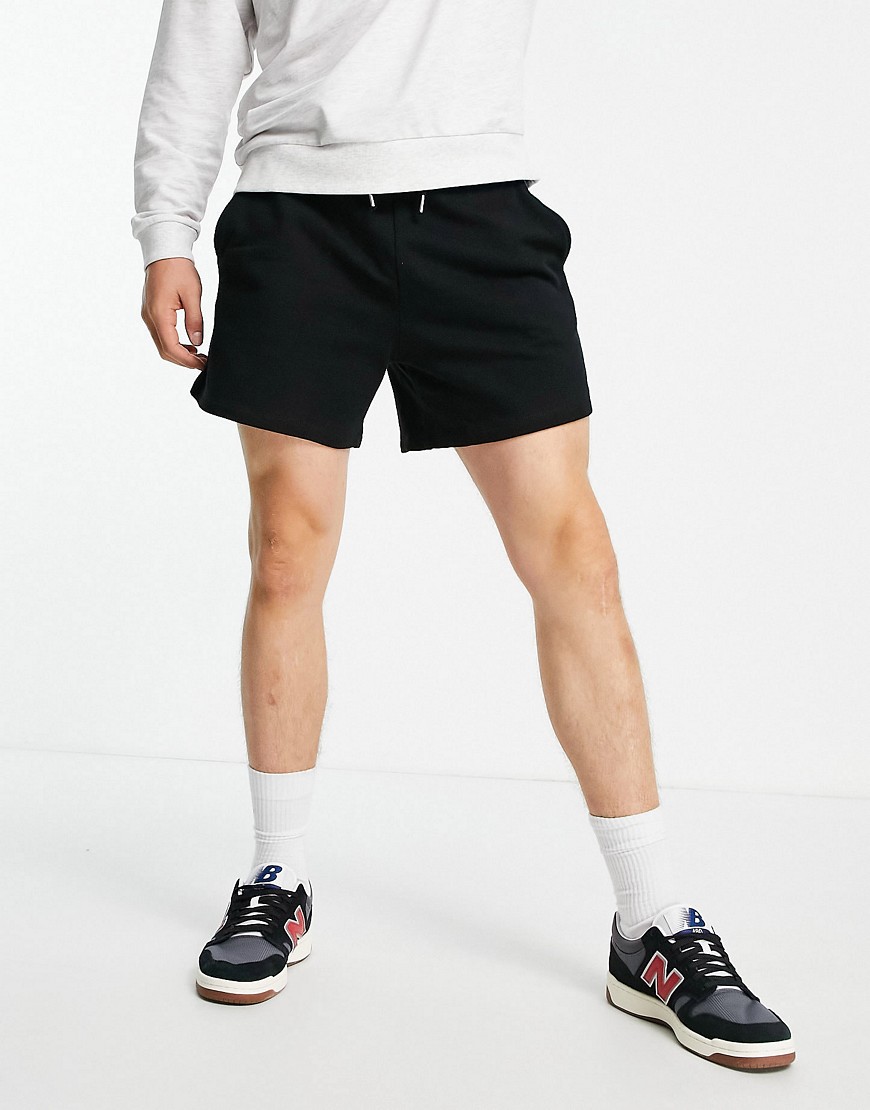 ASOS DESIGN oversized jersey shorts in shorter length in black