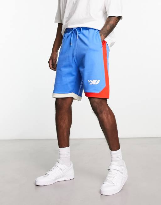 ASOS DESIGN oversized jersey shorts with colour block in blue 