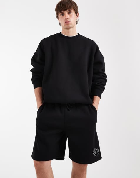 ASOS DESIGN oversized jersey shorts with graphic in black - view 1
